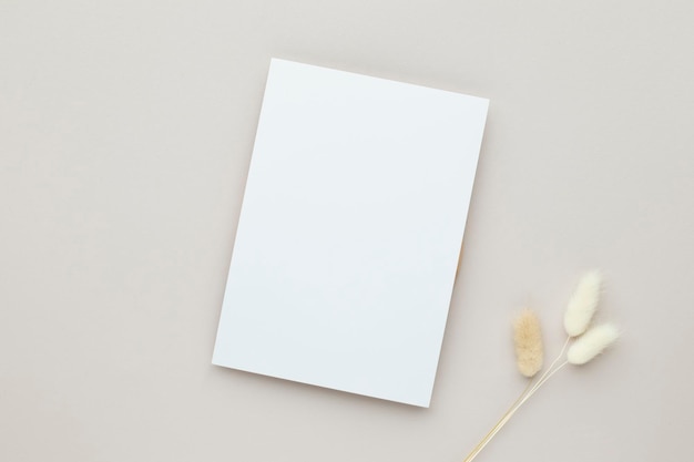 Blank paper cards, Greeting card Mockup with pampas grass on a wooden plate, beige background, Minimal beige workplace composition, flat lay, mockup