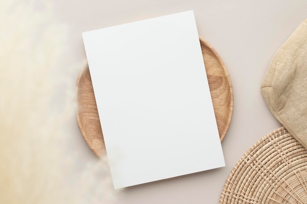 Photo blank paper cards, mockup with pampas grass on a wooden plate, beige background, minimal beige workplace composition, flat lay, mockup