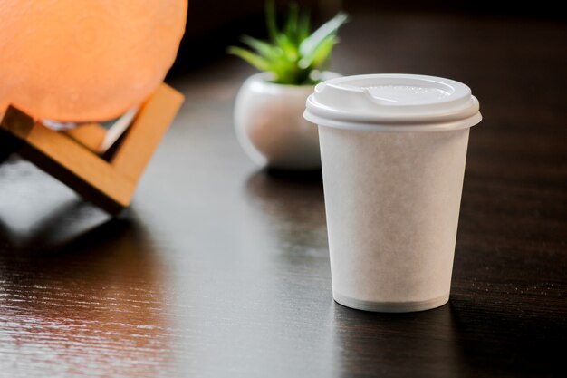 Blank paper coffee cup with plastic cap