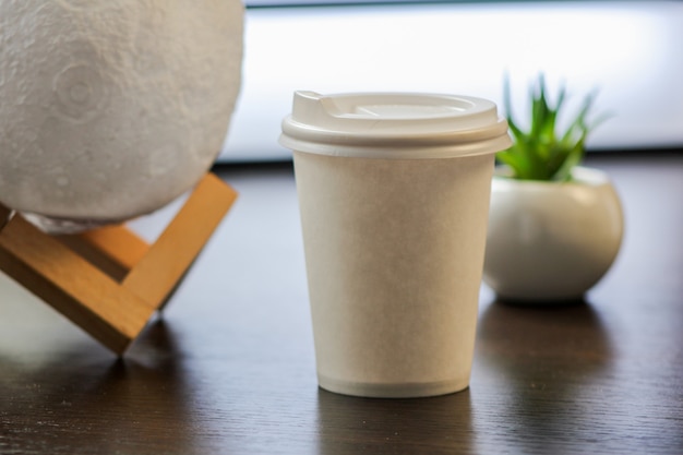 Blank paper coffee cup with plastic cap