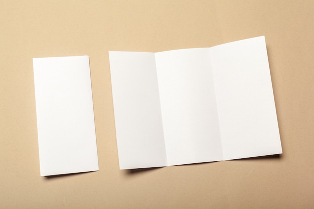 Blank paper pieces  on a beige background