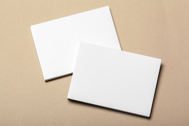 Blank paper pieces  on a beige background