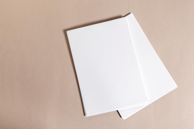 Blank paper pieces for mock up on a beige background