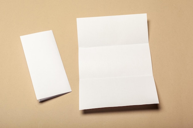 Blank paper pieces for mock up on a beige background