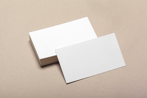 Blank paper pieces for mock up on a beige background