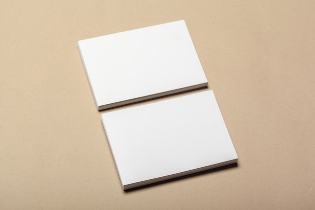 Blank paper pieces for mock up on a beige