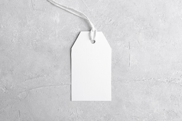 Blank paper rectangular price tag mockup isolated on grey background with copy space