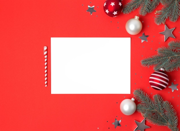 Photo blank paper sheet with christmas decoration, top view