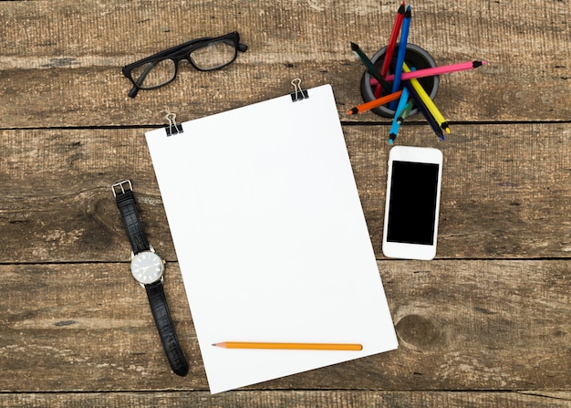 Blank paper with copy space on weathered wooden table top view