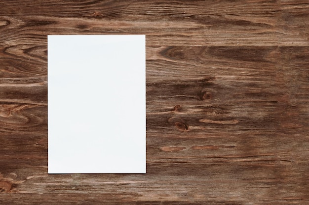 Blank paper on wooden background copy space