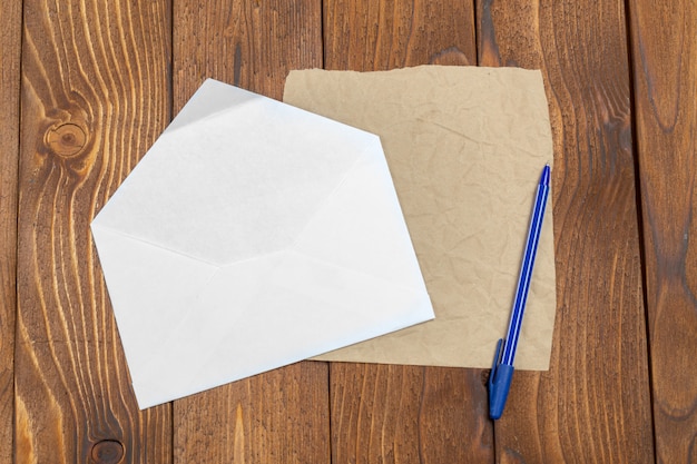 Blank Papers and Pen on Wooden Table