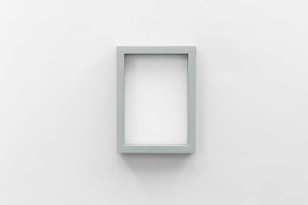 Blank picture frame on white wall