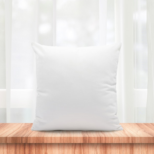 Blank pillows made from soft feather on morning window and curtains 