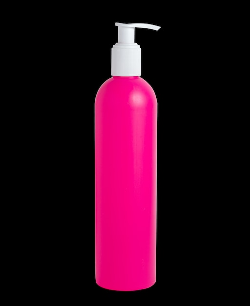 Photo blank pink plastic bottle isolated on black background. packaging for liquid soap, cosmetic.