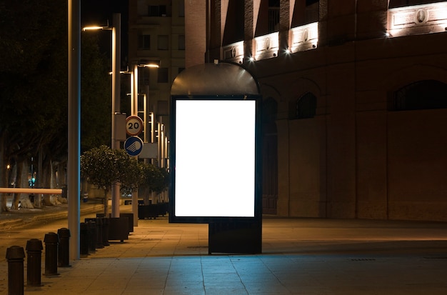 Blank poster presentation for outdoor advertisingbillboard with light in city center