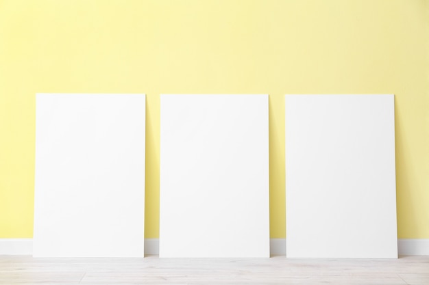 Blank posters near color surface