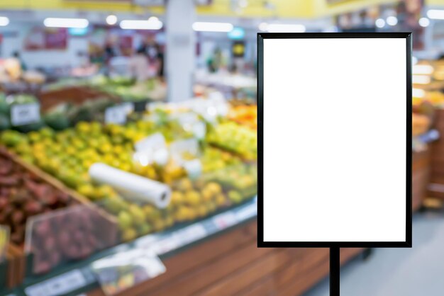 Blank price board with fresh food in supermarket abstract blurred background