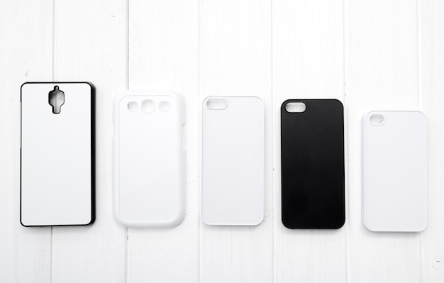 Blank printing Cases for cell phones lying in raw all sizedmatched black and white topview