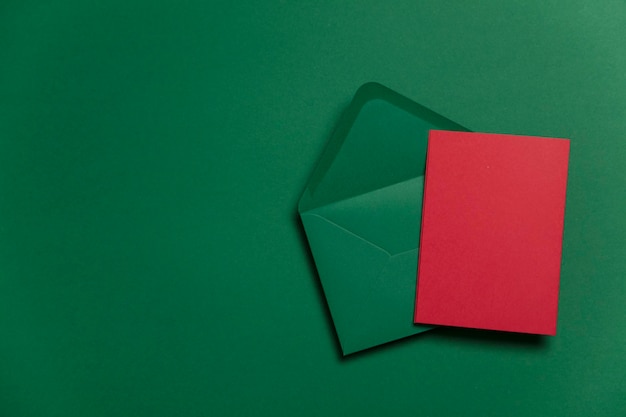 Blank red card with green paper envelope Christmas card template mock up