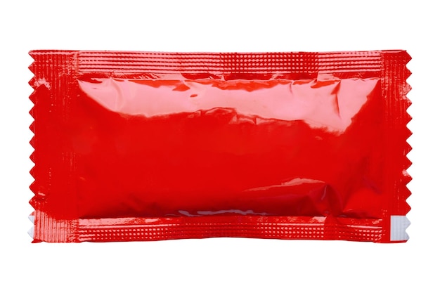 Photo blank red foil tomato ketchup sauce sachet package isolated on white background