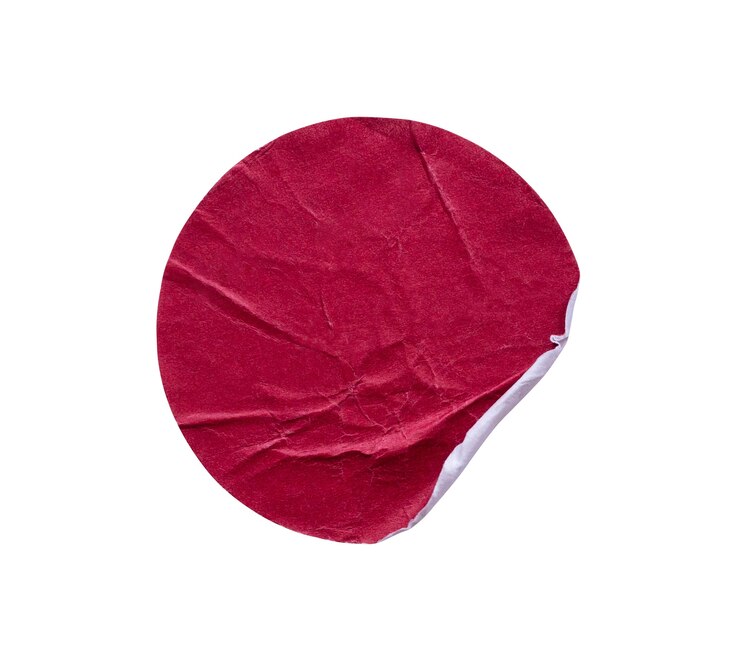 Photo blank red round adhesive paper sticker label isolated on white background