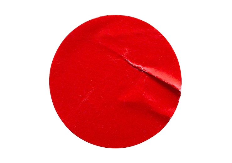 Photo blank red round adhesive paper sticker label isolated on white background
