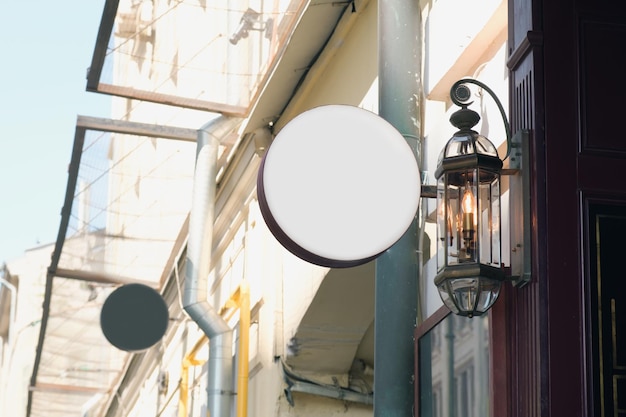 Blank round signs mock up in the urban environment on facade