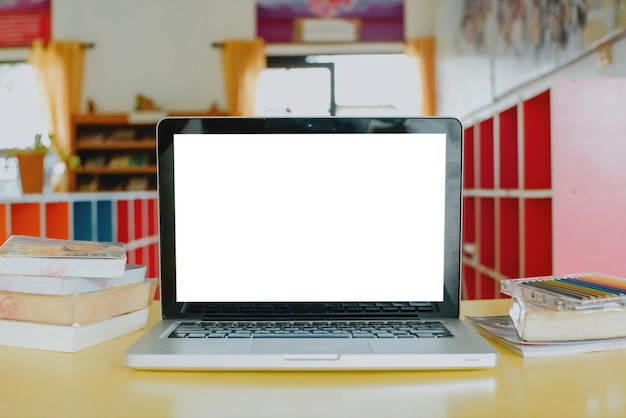 Photo blank screen laptop computer set up for work at school close up