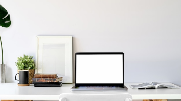 Blank screen laptop in loft studio.