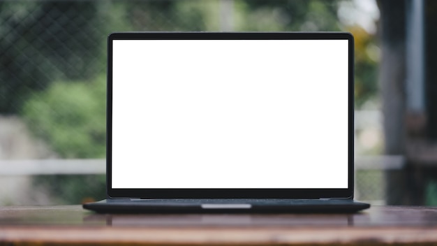 Blank screen white color laptop with blurry background, object put on desk table.