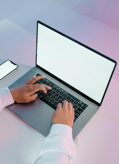 blank screens of a laptop and a smartphone