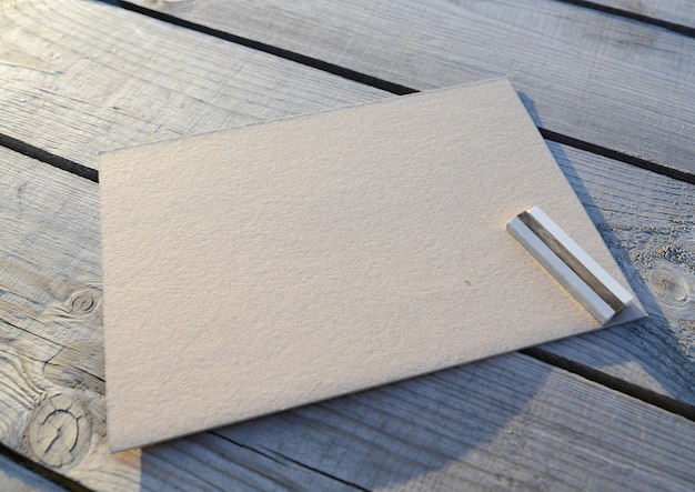 A blank sheet of brown kraft paper or cardboard and colored pastel pencils space for drawing or text