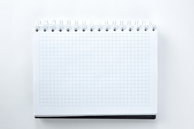 Blank sheet of notebook isolated on a white backgroundphoto with copy space