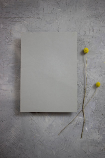 a blank sheet of paper against a background of flowers