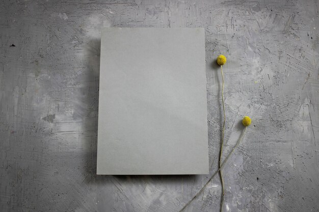 a blank sheet of paper against a background of flowers