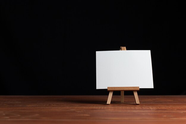 Blank sheet of paper on small easel