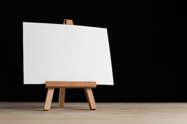 Blank sheet of paper on small easel