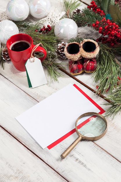 The blank sheet of paper on the wooden table with a pen