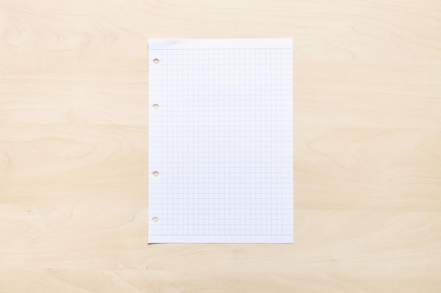 Blank sheet of squared paper on light board