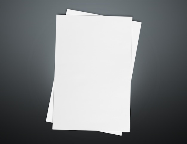 Blank sheets of paper over dark background
