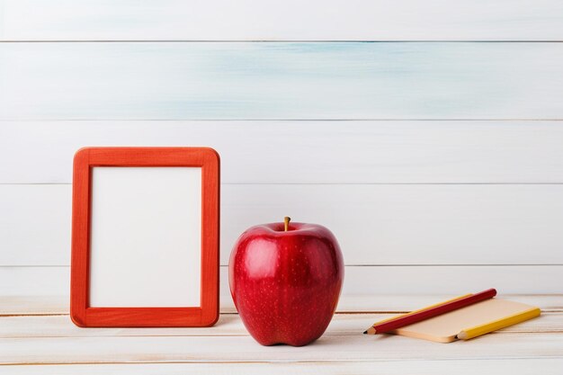 Photo blank small chalkboard with group of school supplies on a white wooden background