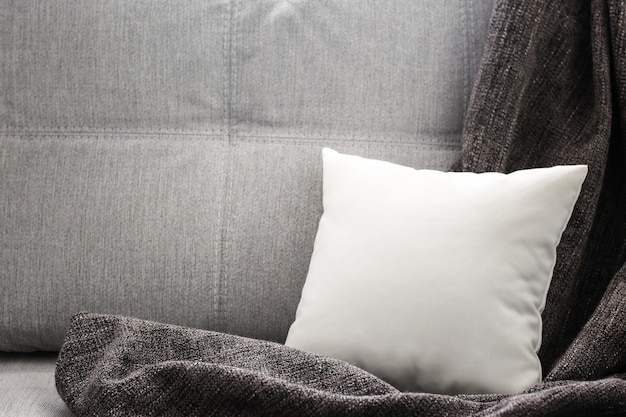 Blank soft pillow on sofa