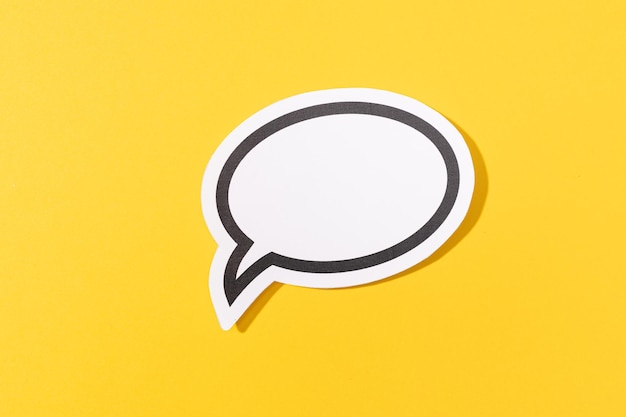 Photo blank speech bubble isolated on yellow background mock up template