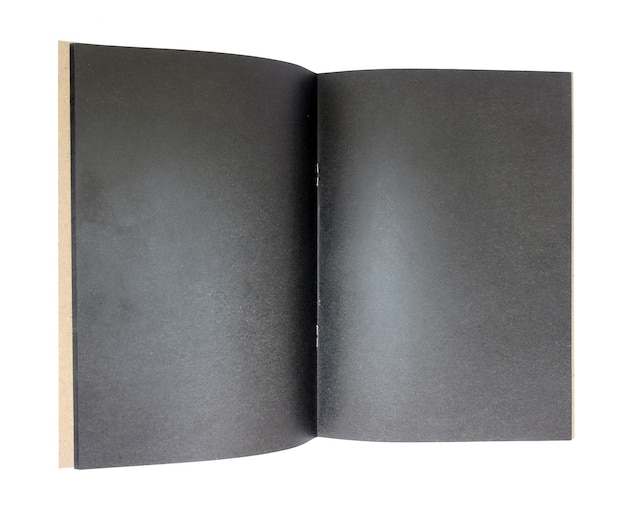 Blank square book at black textured paper background