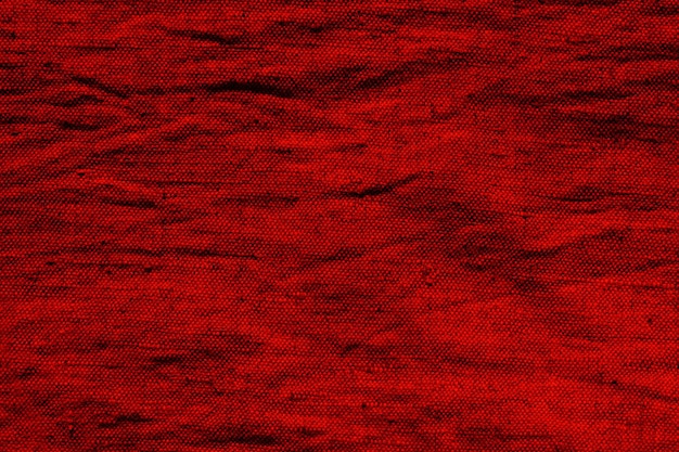거친 구겨진 삼베의 빈 표면 섬유 재료에서 붉은 색의 추상적 인 배경