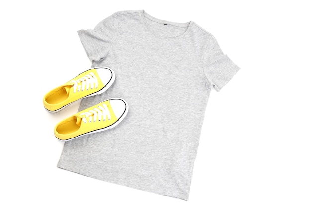 Blank t-shirt and sneakers isolated on white background