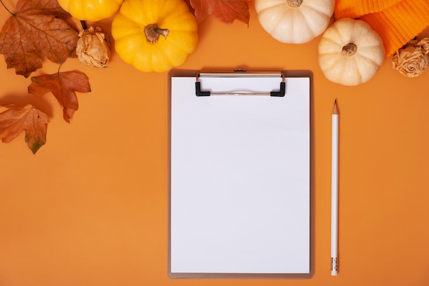 Blank tablet for text next to pumpkins and autumn leaves Autumn theme mockup