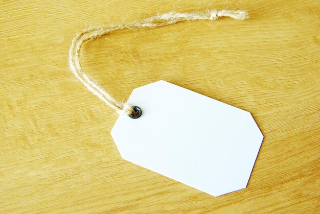 Blank tag isolated on a wooden background