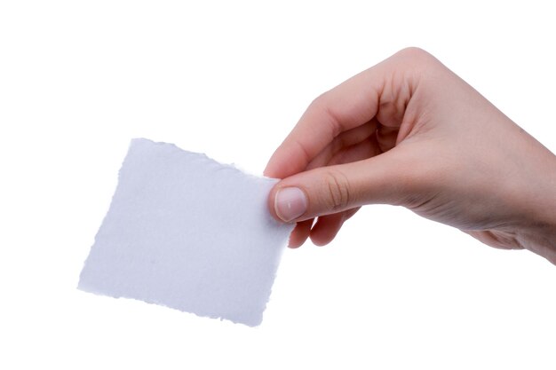 Blank torn notepaper in hand