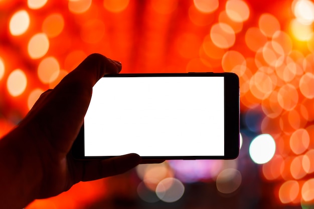 Photo blank white background in smartphone on bokeh